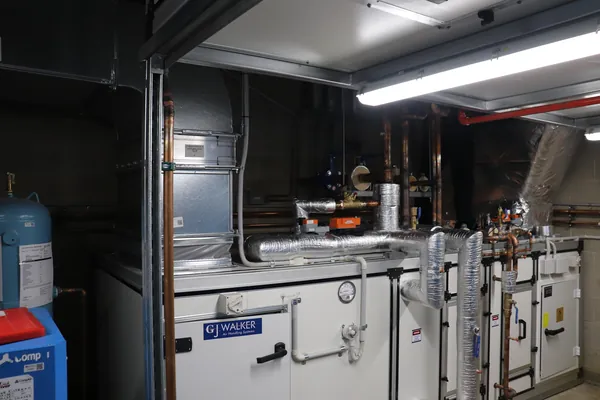 Plant room with air handling unit and insulated ductwork connections